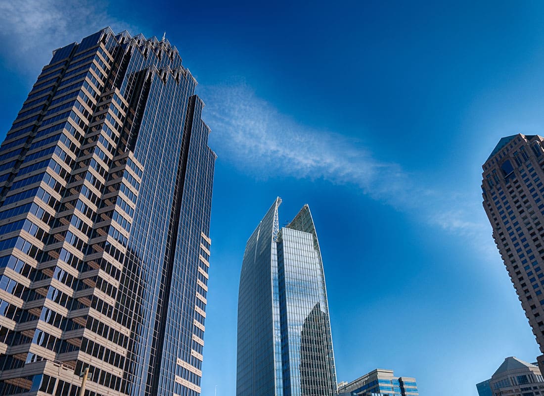 Business Insurance - View of Modern Glass Commercial Buildings in Downtown Atlanta Georgia Against a Bright Blue Sky