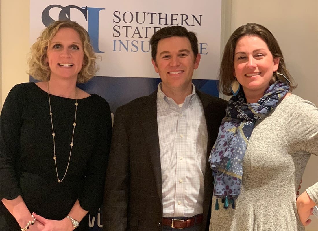 We Are Independent - Portrait of Team Members Jim with Meghan and Katie Standing in the Southern States Insurance Office
